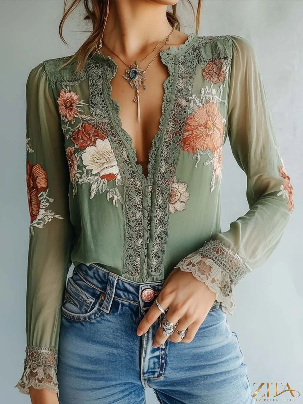 Zita La Belle Elite lace detail floral blouse featuring delicate lace accents and vibrant floral patterns on lightweight fabric.