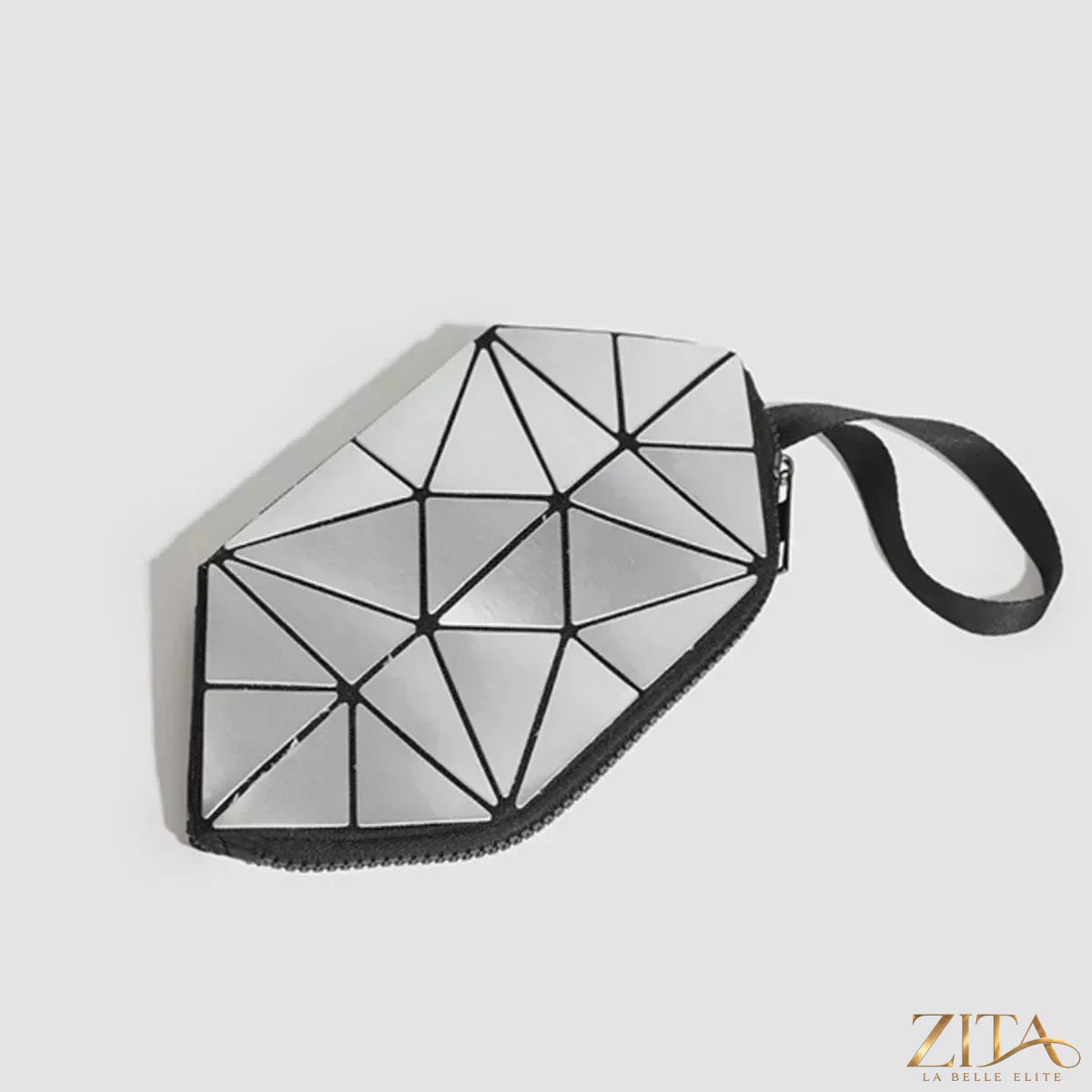 Geometric leather wristlet in neutral tones with a sleek strap, designed by Trendsi for stylish everyday use.