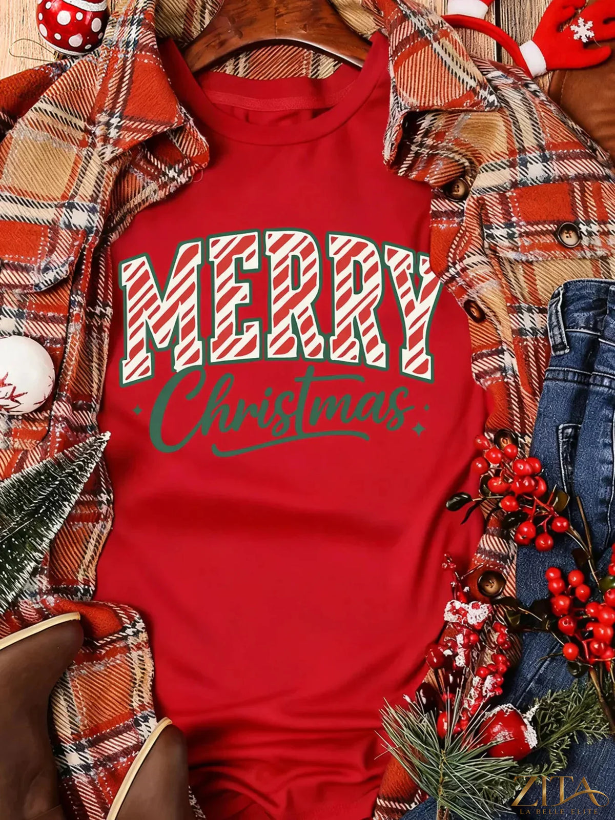Red Merry Christmas short sleeve graphic tee by Trendsi featuring festive holiday design and bold holiday message.