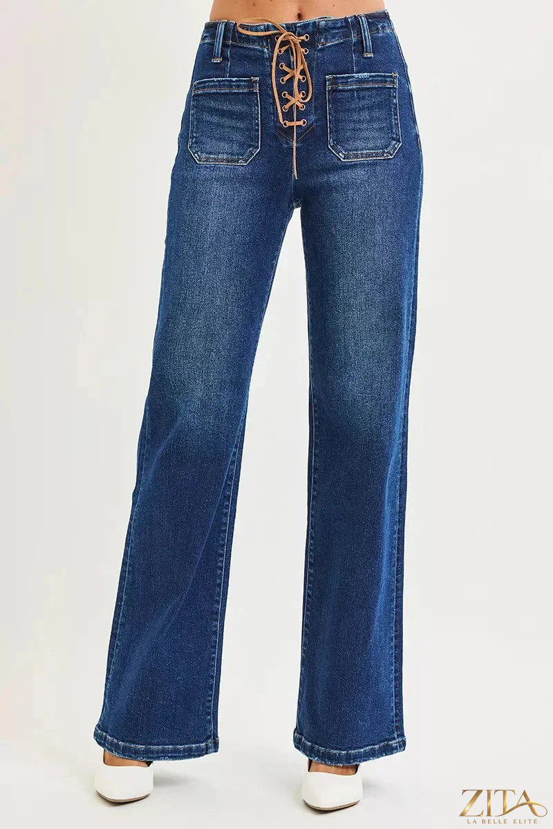 Plus size Zita La Belle Elite RISEN high rise tie-front wide leg jeans with front pockets and belt loops on a model.