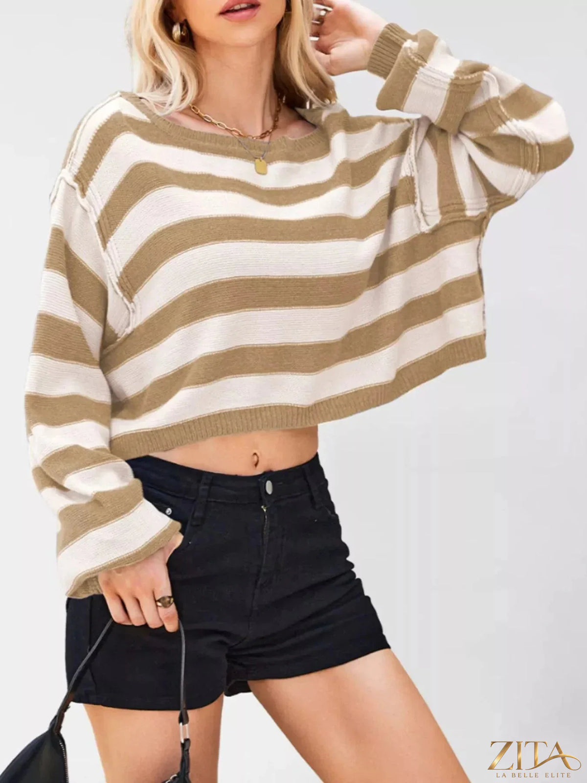 Striped boat neck sweater from Trendsi featuring classic horizontal stripes and a cozy, relaxed fit.
