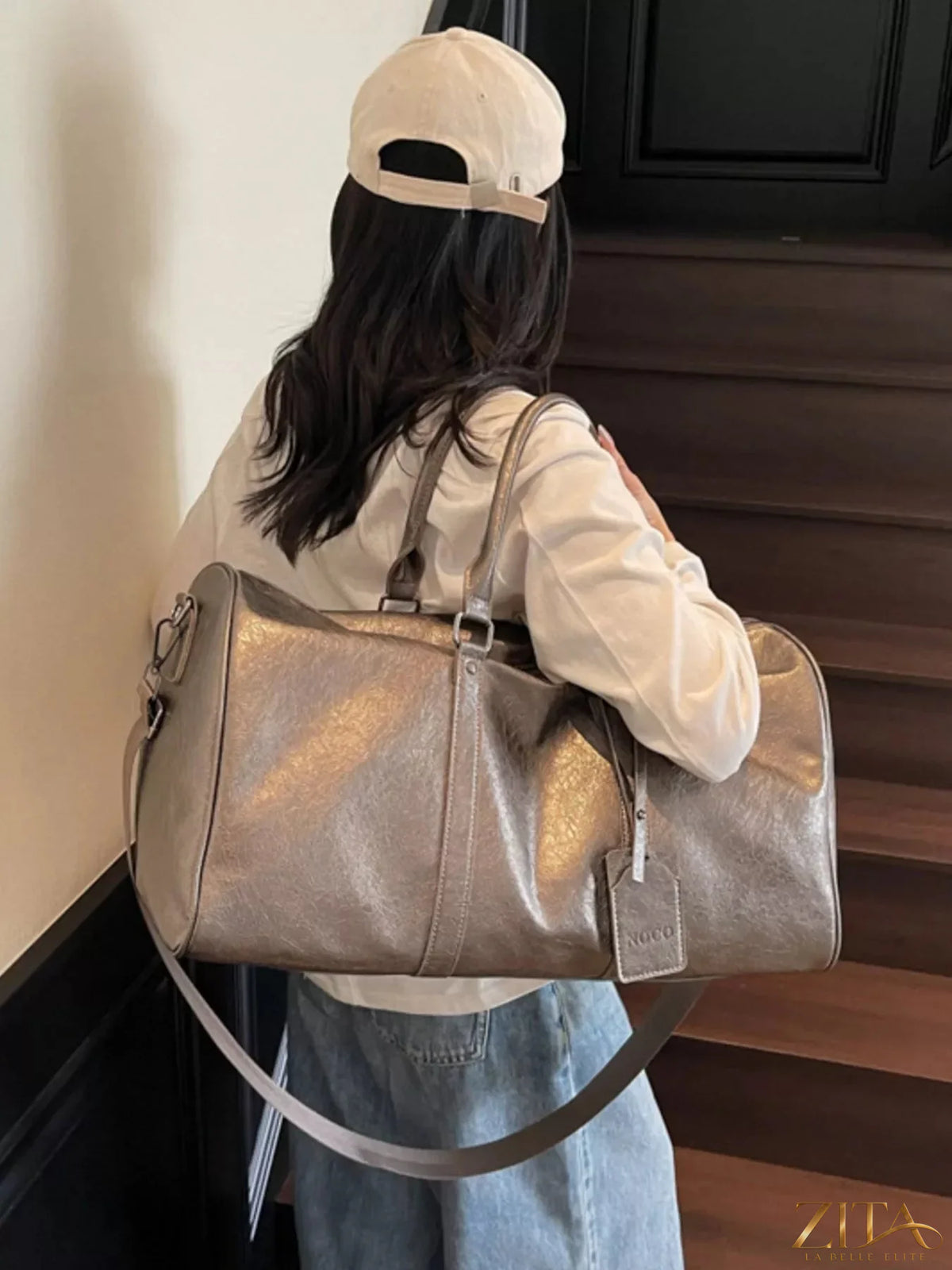 Trendsi PU leather duffle bag with sturdy handles and zipper closure, featuring a stylish, spacious design for travel and daily use.