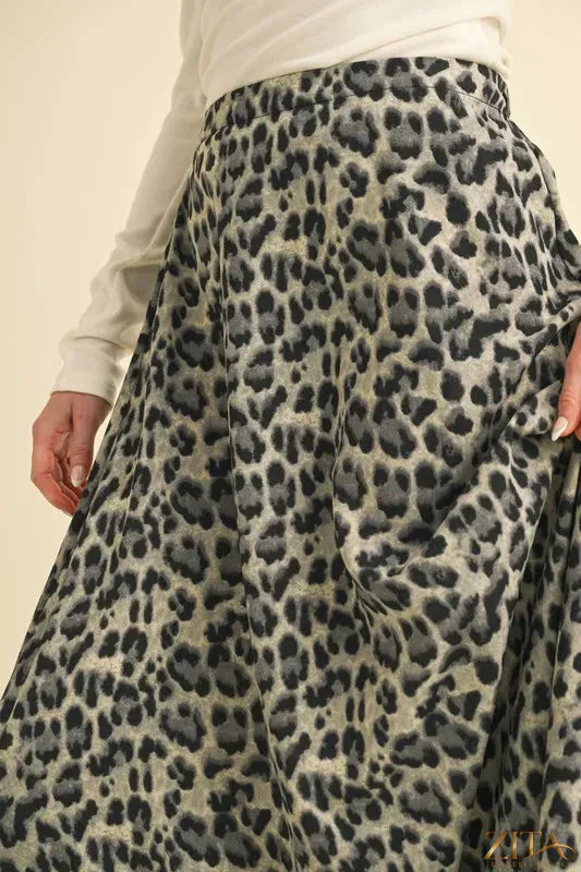 Aemi+Co leopard print midi skirt from Trendsi, featuring a flowy silhouette and stylish animal print fabric.