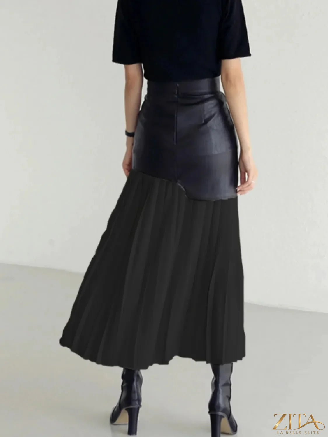 Patchwork contrast pleated skirt by Trendsi featuring vibrant mixed fabric patches and flowing pleats for a stylish look.