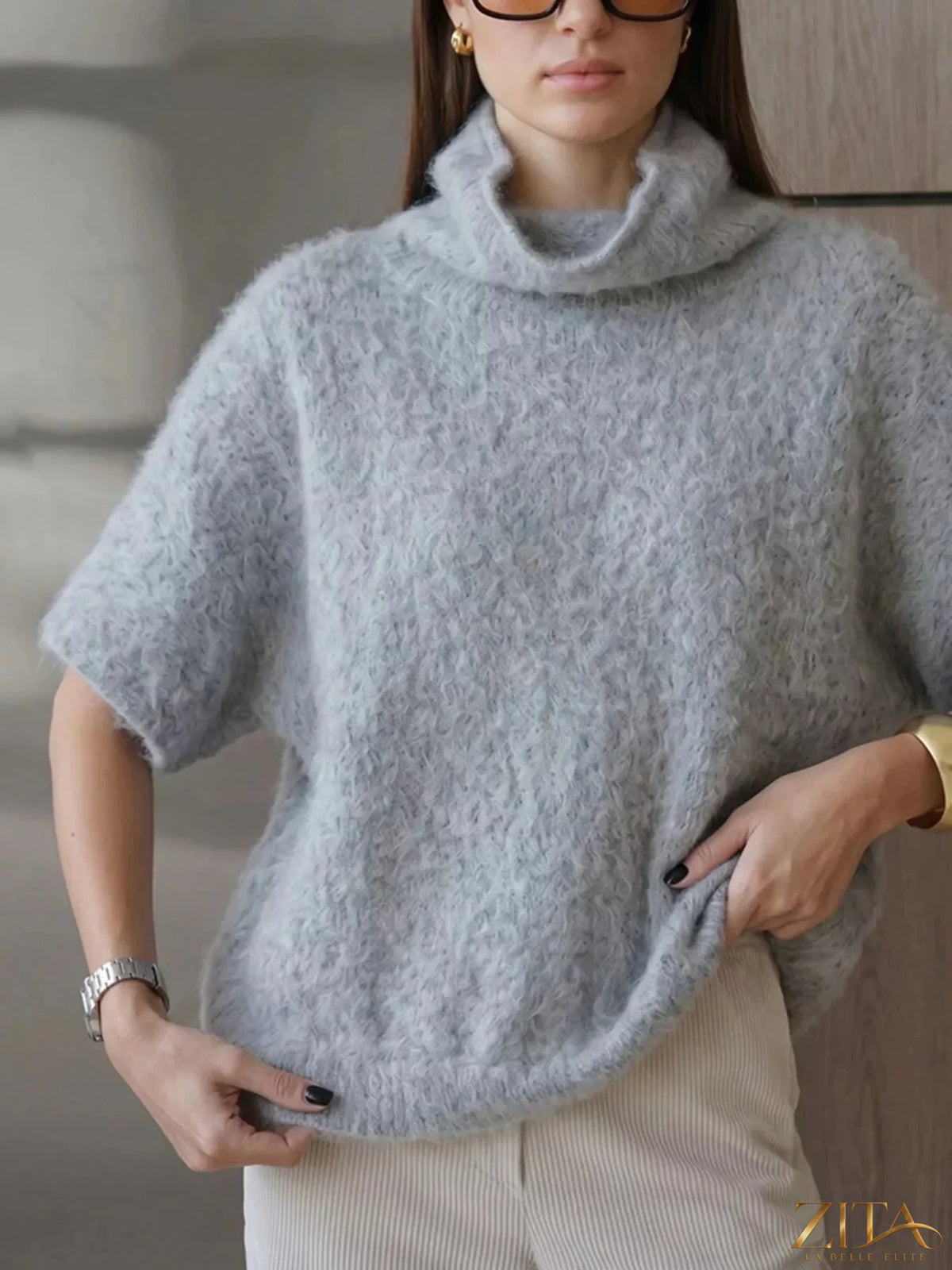 Zita La Belle Elite fuzzy short sleeve turtleneck sweater in soft, cozy fabric, displayed on a neutral background.