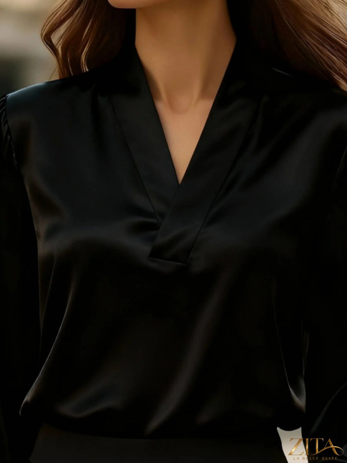 Zita La Belle Elite satin V-neck long sleeve blouse in soft fabric, shown on a hanger with a smooth, shiny finish.