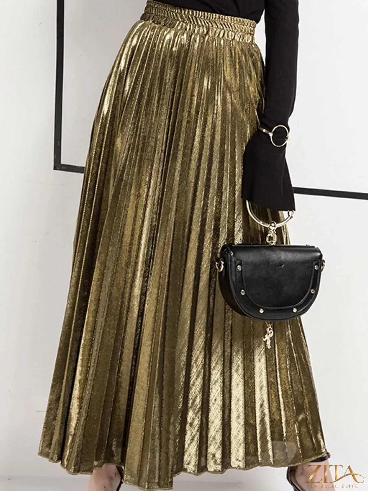 High-waisted pleated maxi skirt by Trendsi featuring flowing fabric and a flattering high waist, perfect for casual or formal wear.