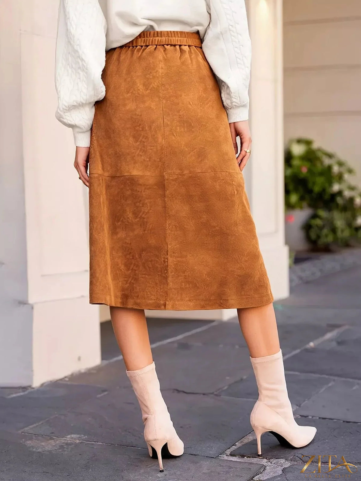 Button-front midi skirt by Trendsi featuring a flowy fabric and classic midi length, shown in a natural beige color.