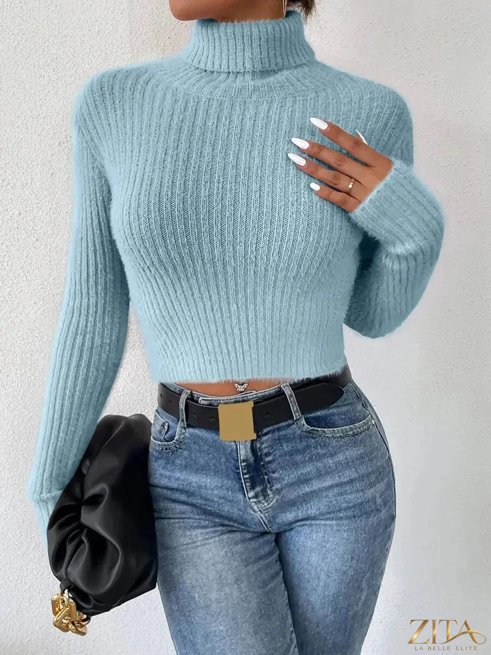 Ribbed turtleneck long sleeve sweater from Trendsi, featuring a fitted design and cozy knit fabric in a neutral color.