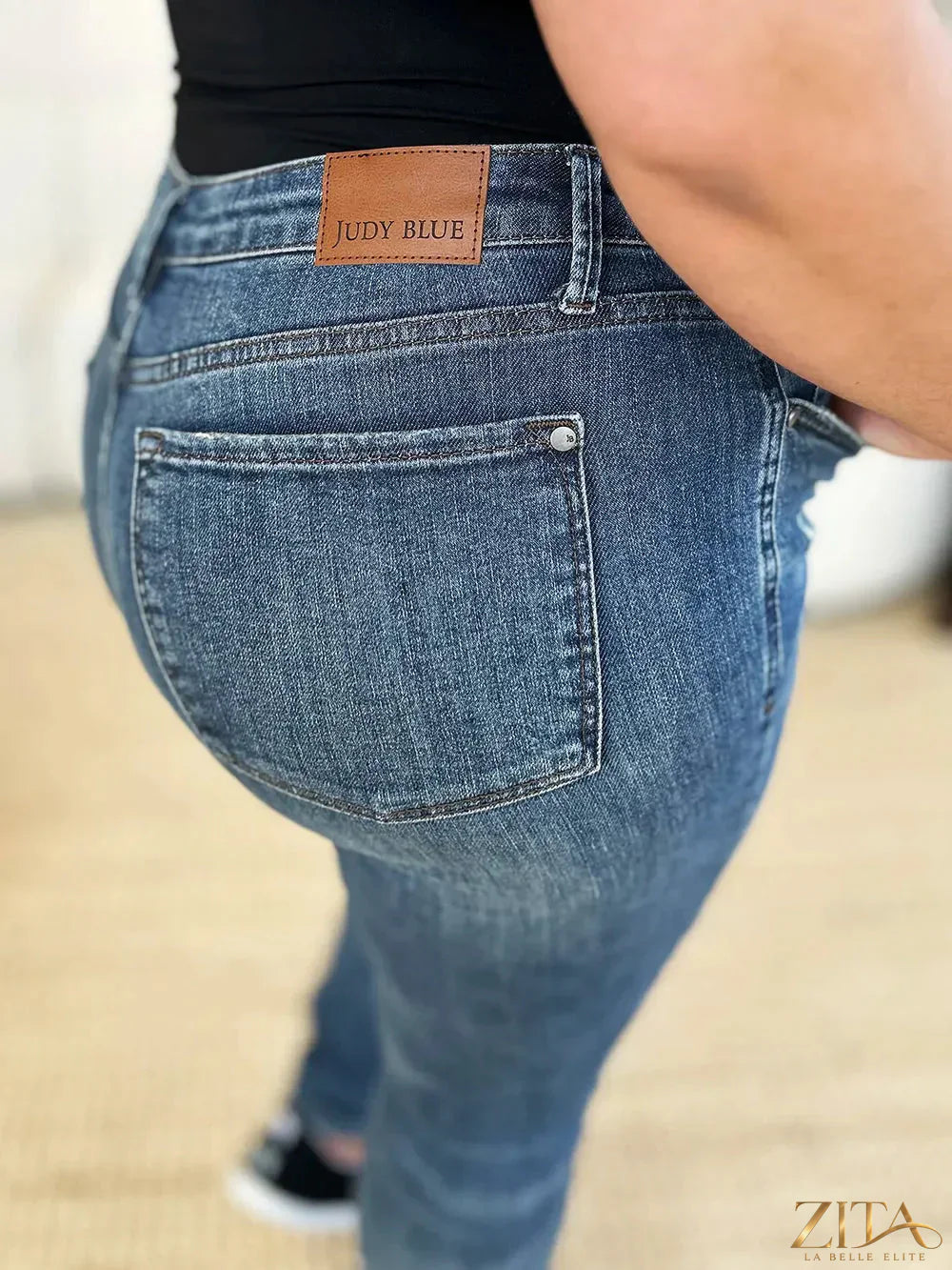 Zita La Belle Elite Judy Blue full size mid waist distressed slim jeans with frayed details and slim fit silhouette.