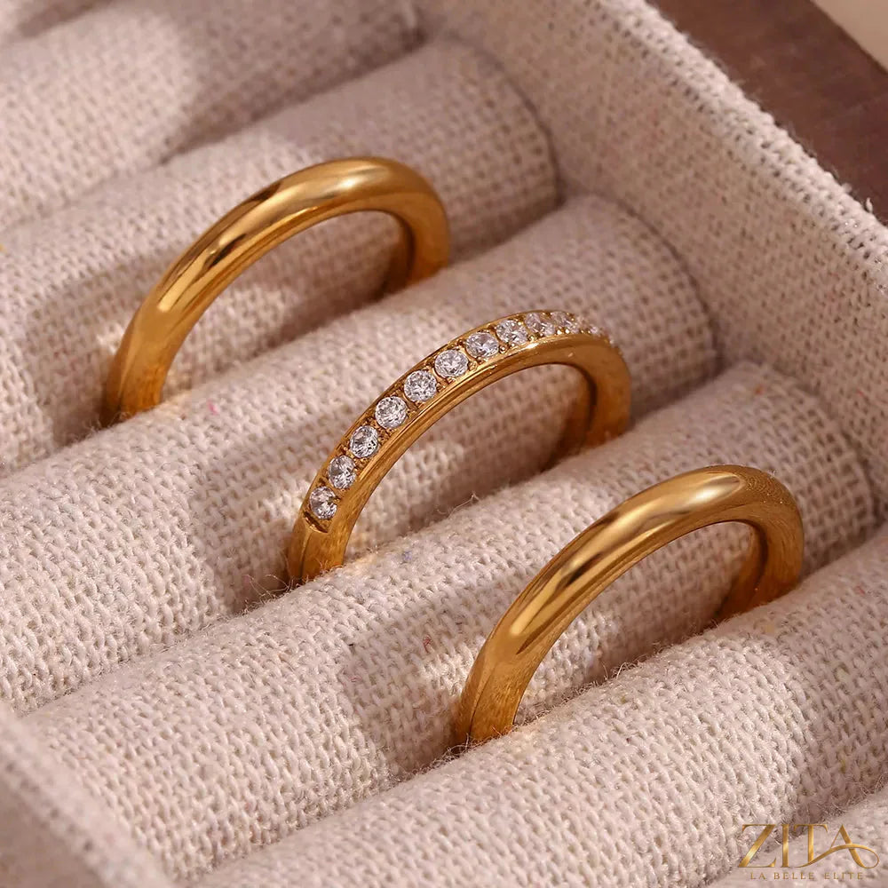 Set of three stainless steel zircon rings by Zita La Belle Elite, showcasing shiny metallic bands with sparkling zircon stones.