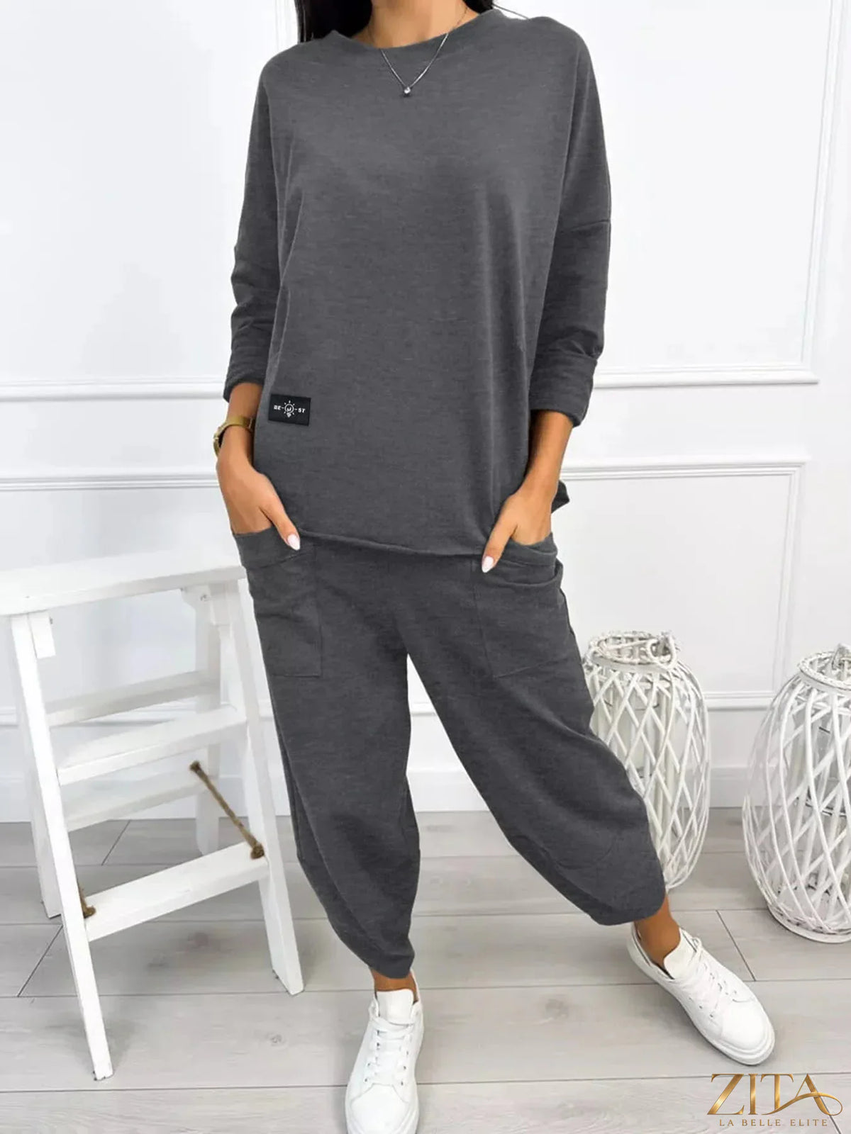 Plus size casual loose fit top and pants two-piece set from Trendsi, featuring comfortable, stylish fabric and relaxed fit.