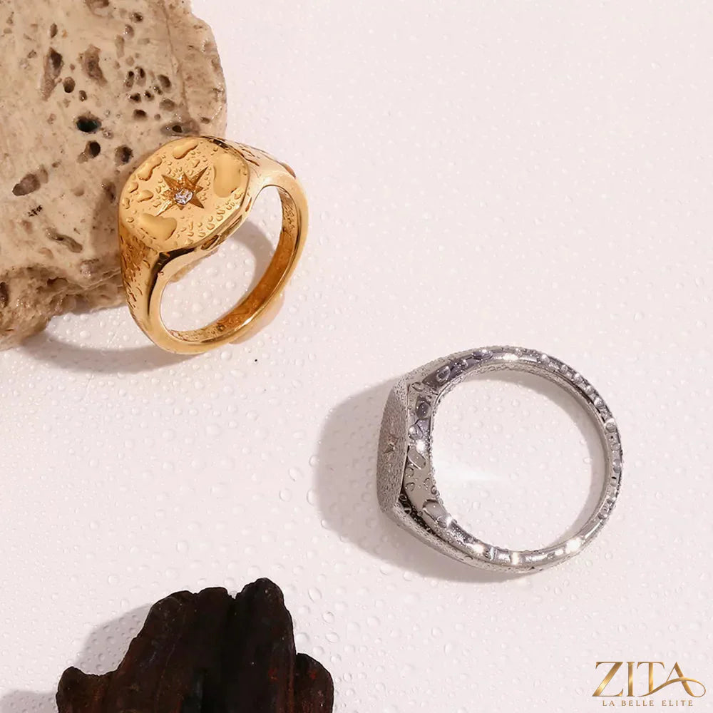 Minimalist North Star signet ring by Zita La Belle Elite, featuring a sleek design with a star motif on polished metal.