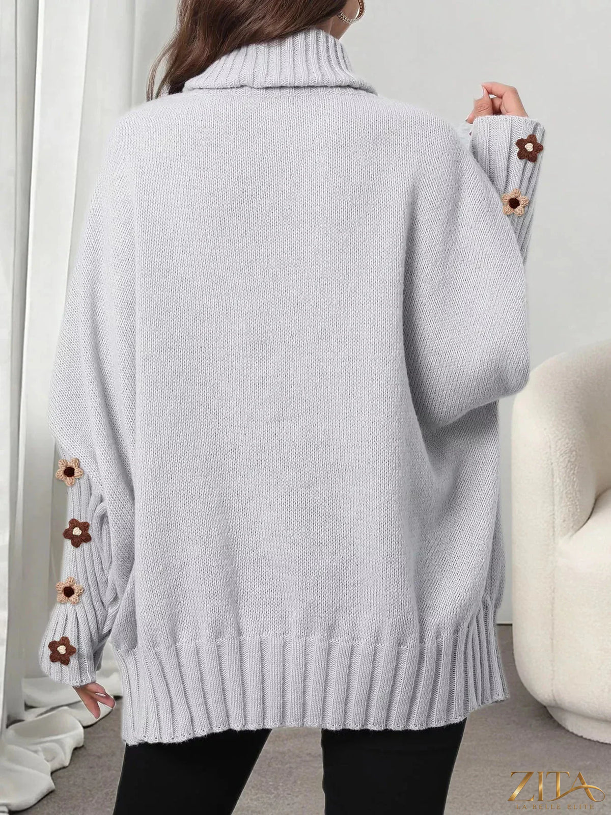 Zita La Belle Elite oversized turtleneck sweater with floral applique sleeves, cozy knit design in a stylish, relaxed fit.