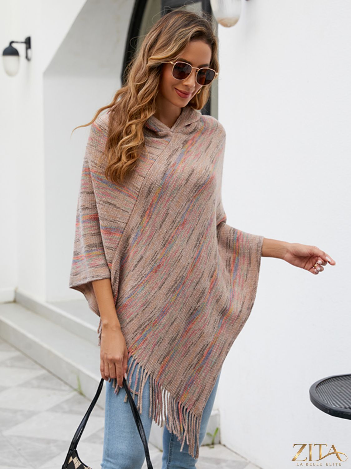 Zita La Belle Elite fringe hem hooded poncho with flowing fabric and stylish fringe detail, perfect for layering and outdoor wear.