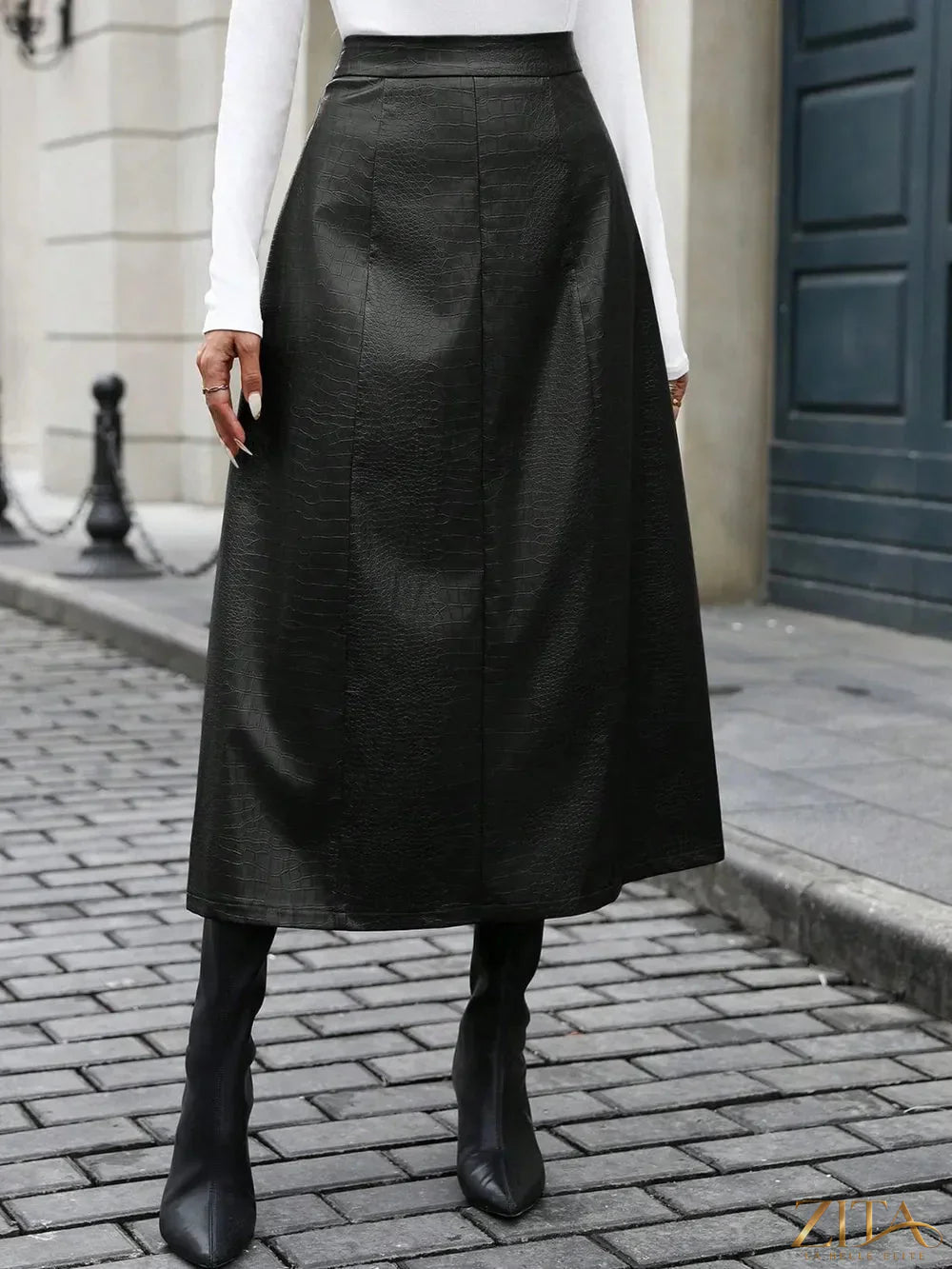 High waist midi skirt by Trendsi featuring a flowy silhouette and versatile length, perfect for casual or dressy outfits.