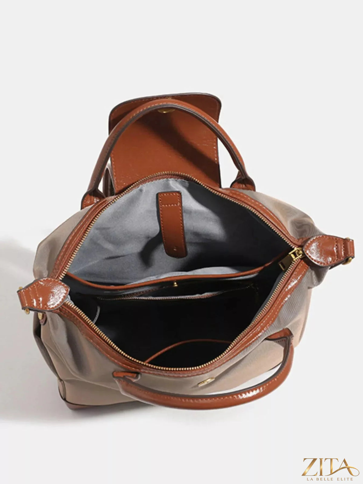 Leather trim backpack bag featuring adjustable straps and multiple compartments, ideal for stylish everyday use.