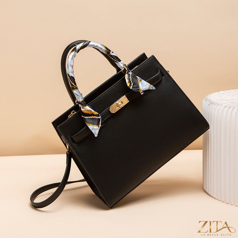 Zita La Belle Elite leather handbag with top handle and sleek design, crafted from high-quality brown leather.