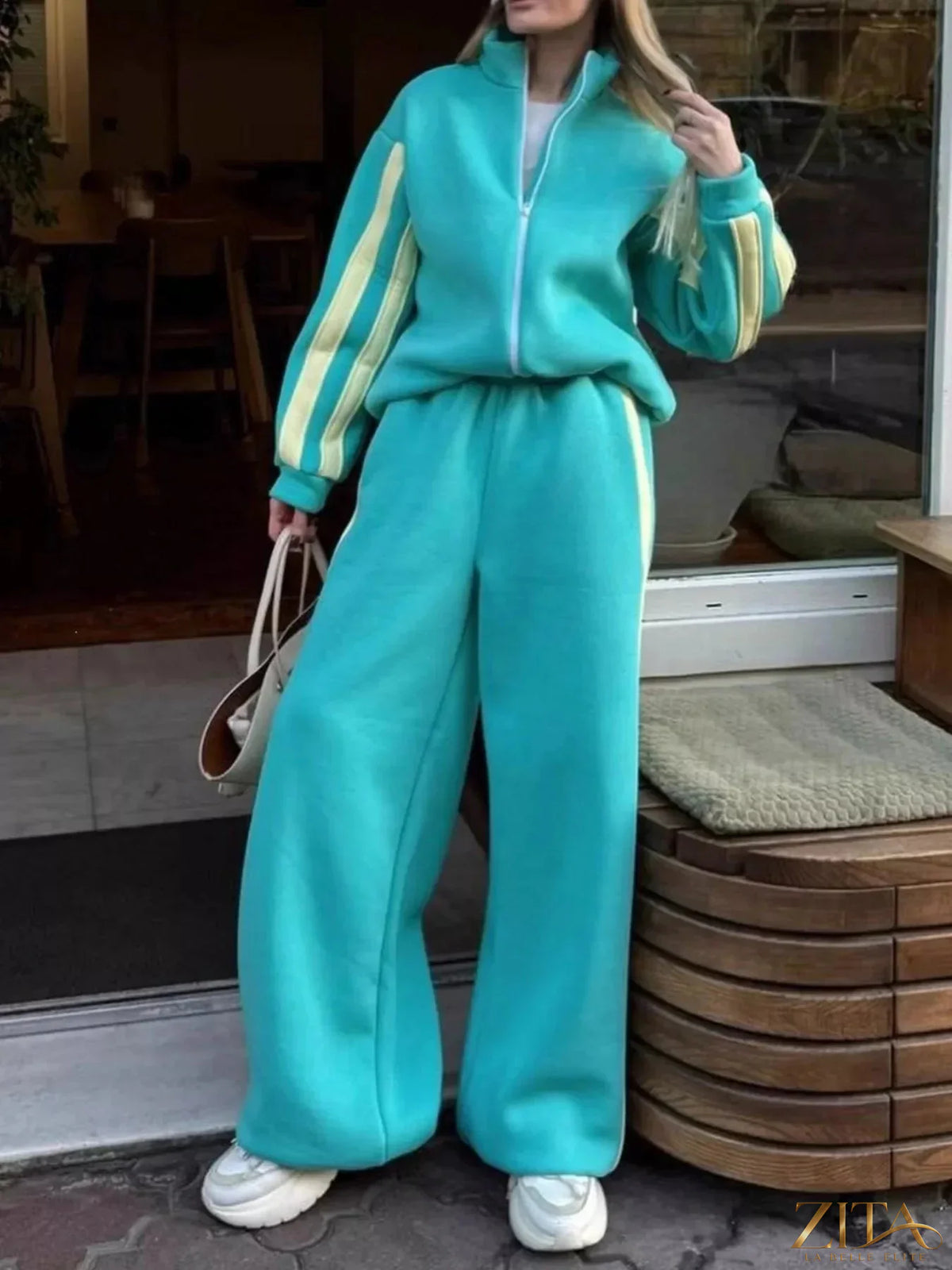 Zita La Belle Elite contrast striped zip-up top and matching pants set, featuring bold black and white vertical stripes.