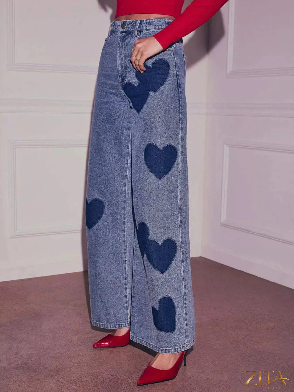 Zita La Belle Elite Heart High Waist Wide Leg Jeans displayed on a hanger, showcasing the front view with heart-shaped pockets.