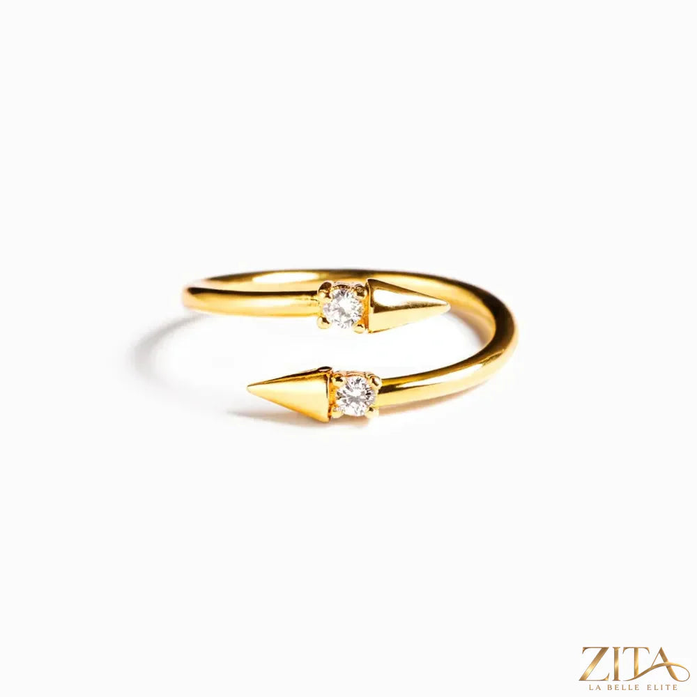 Sterling silver bypass ring with inlaid zircon stones, crafted by Zita La Belle Elite, showcasing a sleek, curved design.