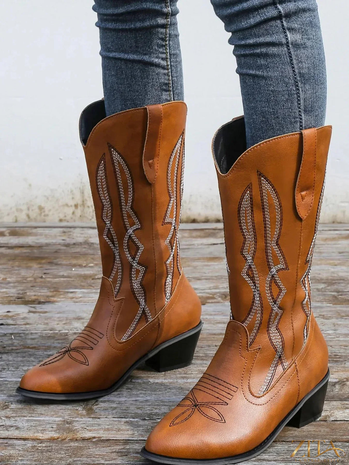 Western embroidered cowgirl boots with detailed embroidery, pointed toe, and stacked heel from Trendsi.