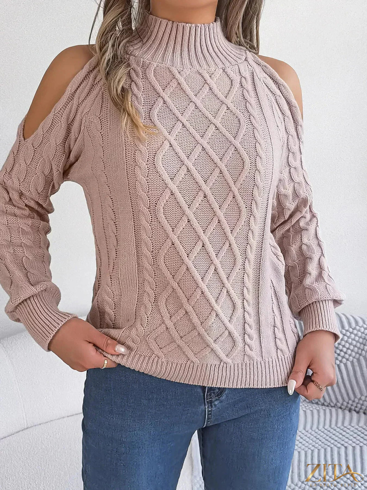Zita La Belle Elite cold-shoulder cable knit sweater in soft fabric, featuring open shoulders and textured knitting pattern.
