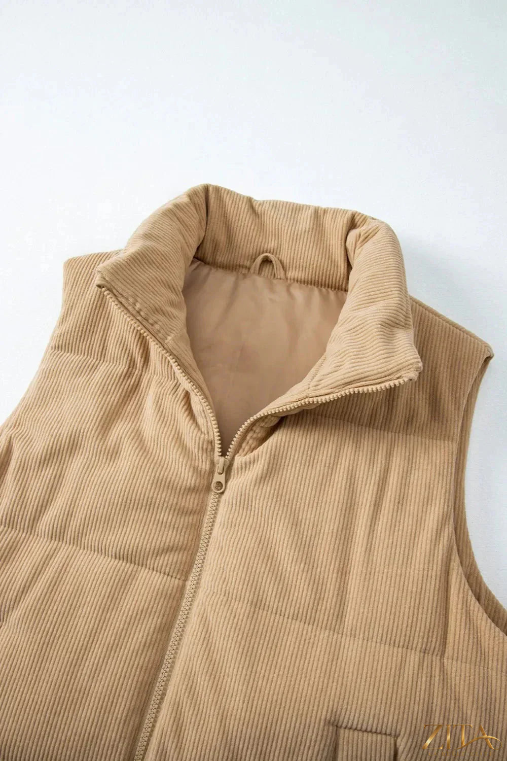 Trendsi pocketed zip-up turtleneck vest coat displayed on a hanger, featuring a fitted design with front pockets and a high collar.
