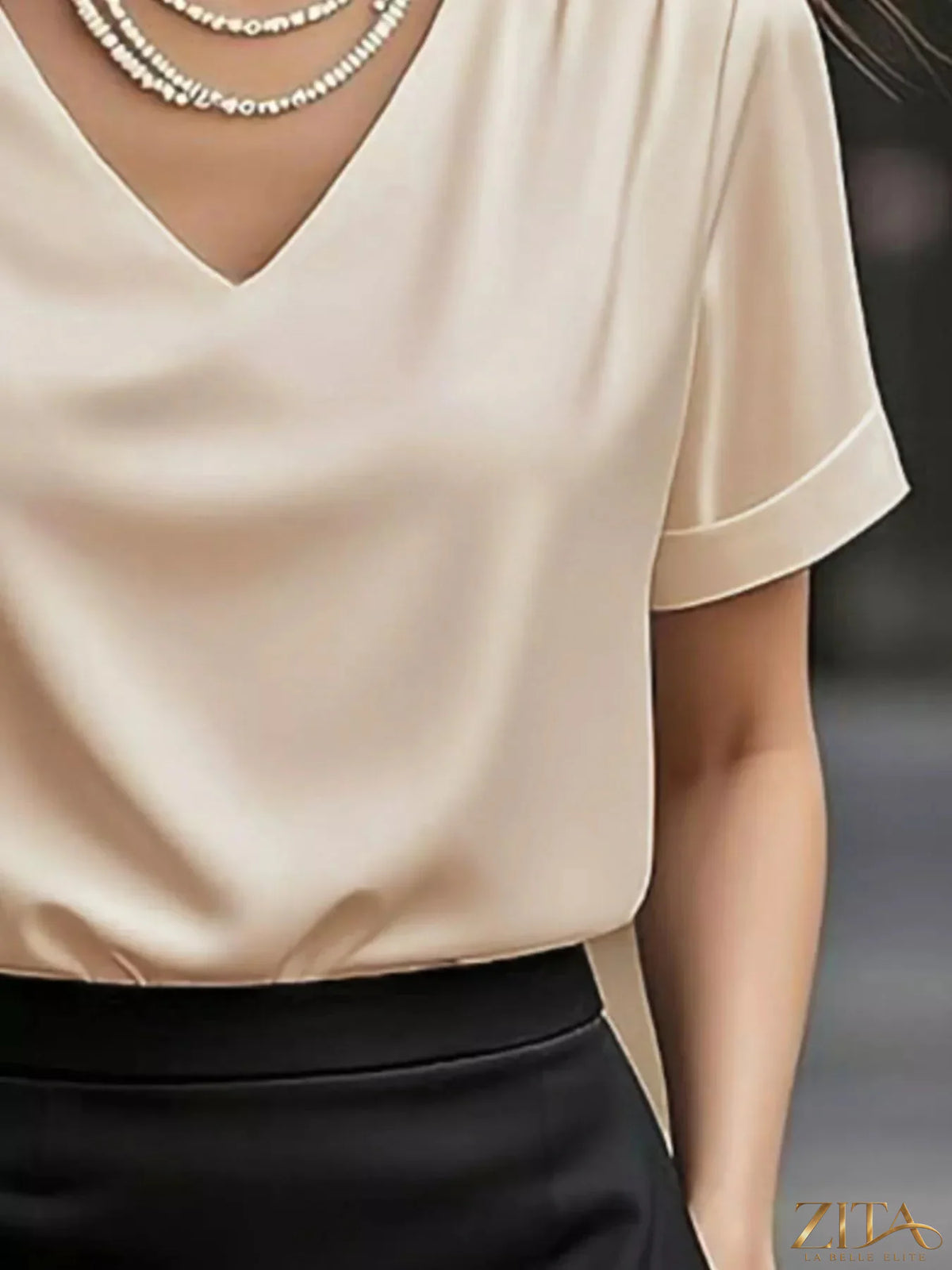 Zita La Belle Elite V-neck short sleeve satin blouse in elegant, smooth fabric with a flattering fit.