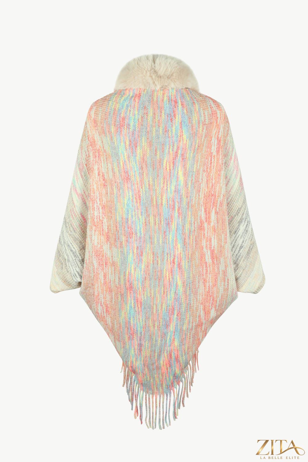 Open front fringe hem poncho from Trendsi, featuring a flowy design with fringe details on the hem, perfect for layering.