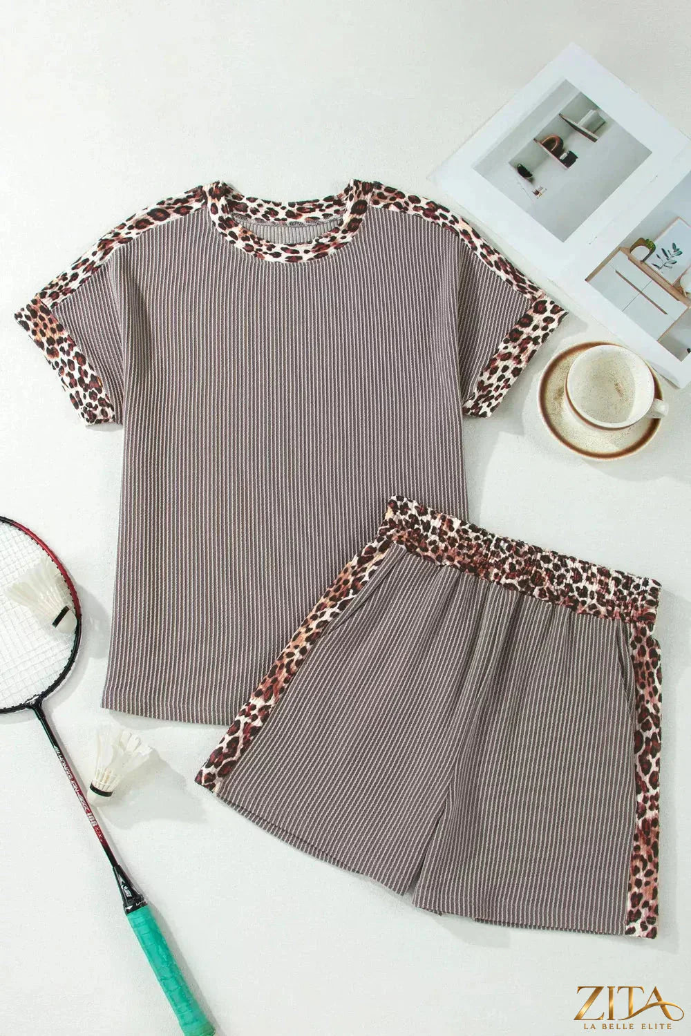 Leopard trim ribbed knit tee and shorts set by Trendsi, featuring a matching two-piece design with leopard accents and ribbed fabric.