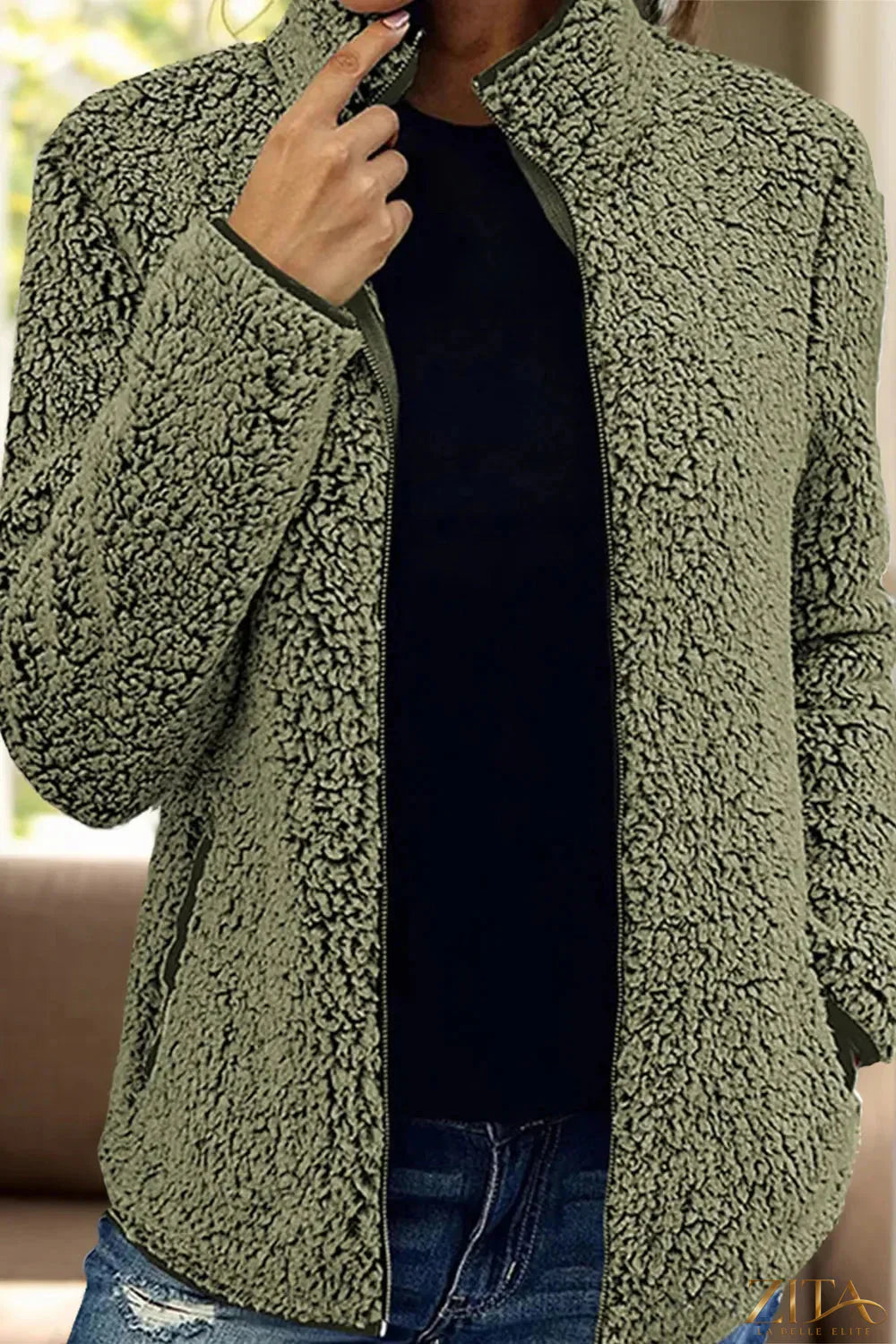 Trendsi pocketed zip-up turtleneck jacket featuring a fitted style, soft fabric, and front pockets for casual winter wear.