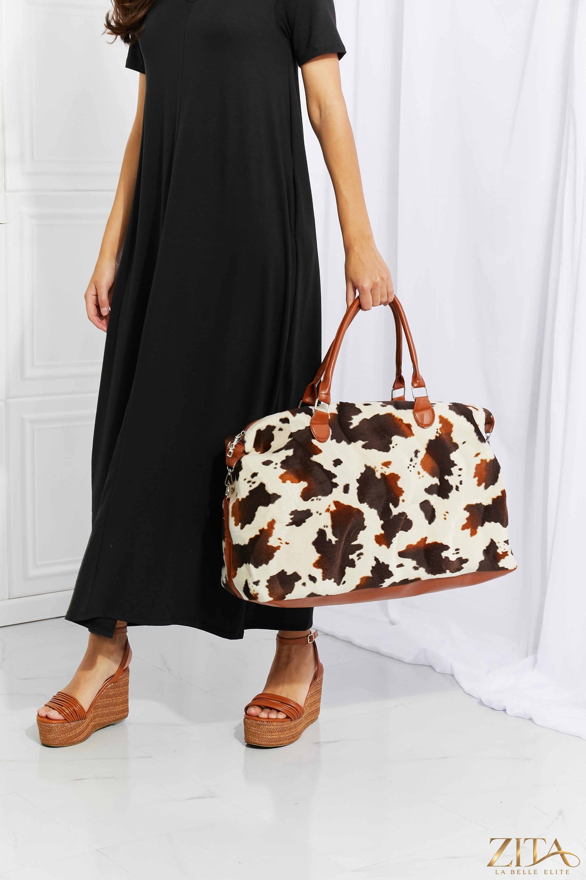 Animal print plush weekender bag by Zita La Belle Elite with soft fabric and spacious design for travel and storage.