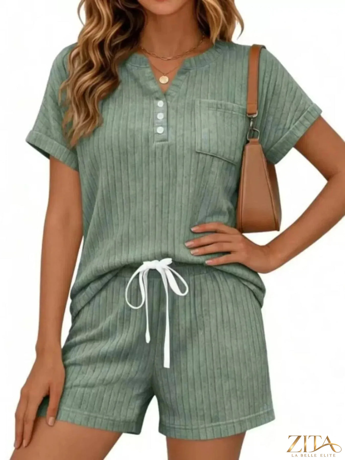 Casual ribbed knit tee and shorts set from Trendsi, featuring a comfortable, stylish matching top and bottom in a soft fabric.