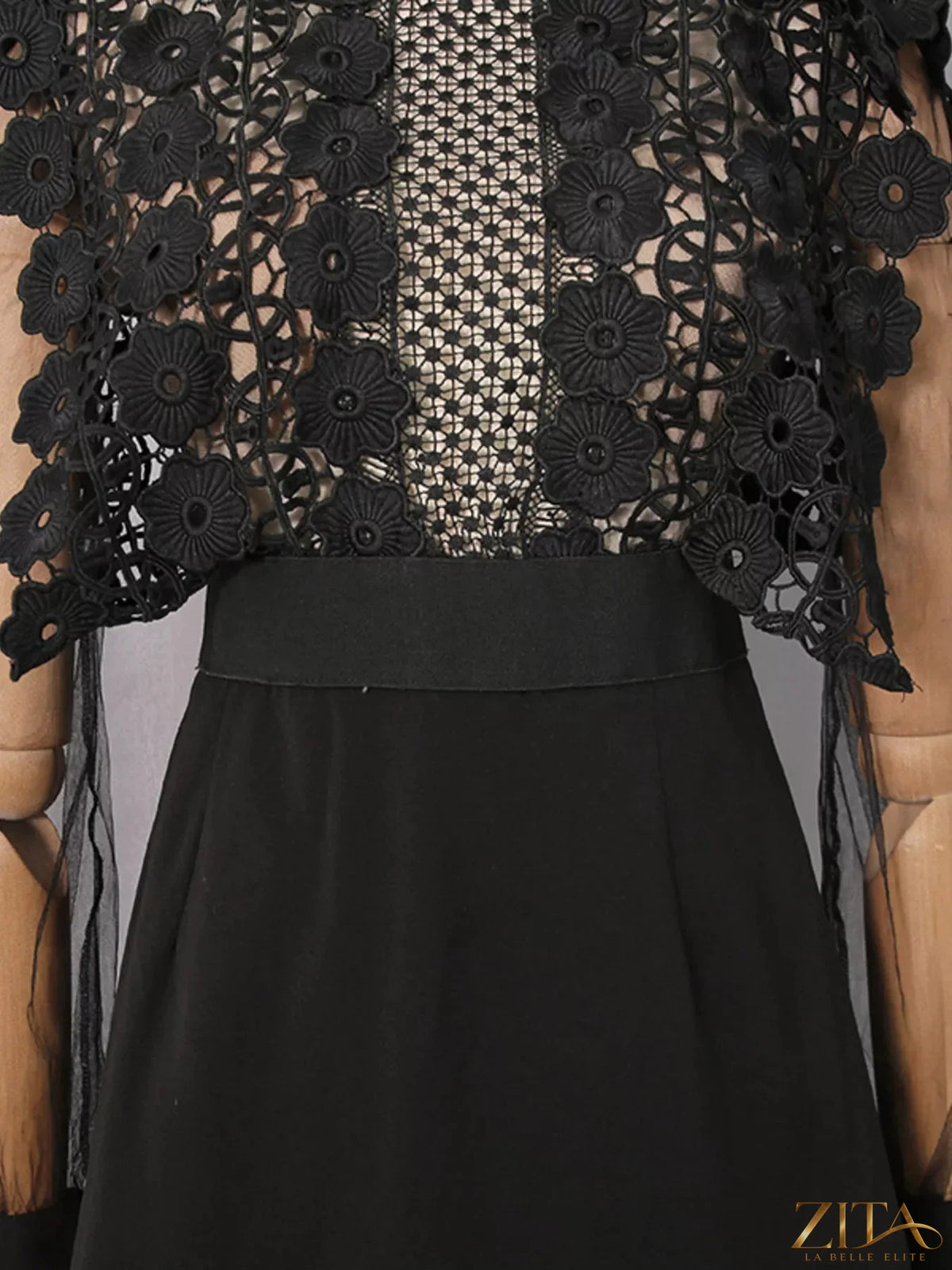Lace sheer sleeve mini dress by Trendsi featuring delicate lace fabric and elegant sheer long sleeves.