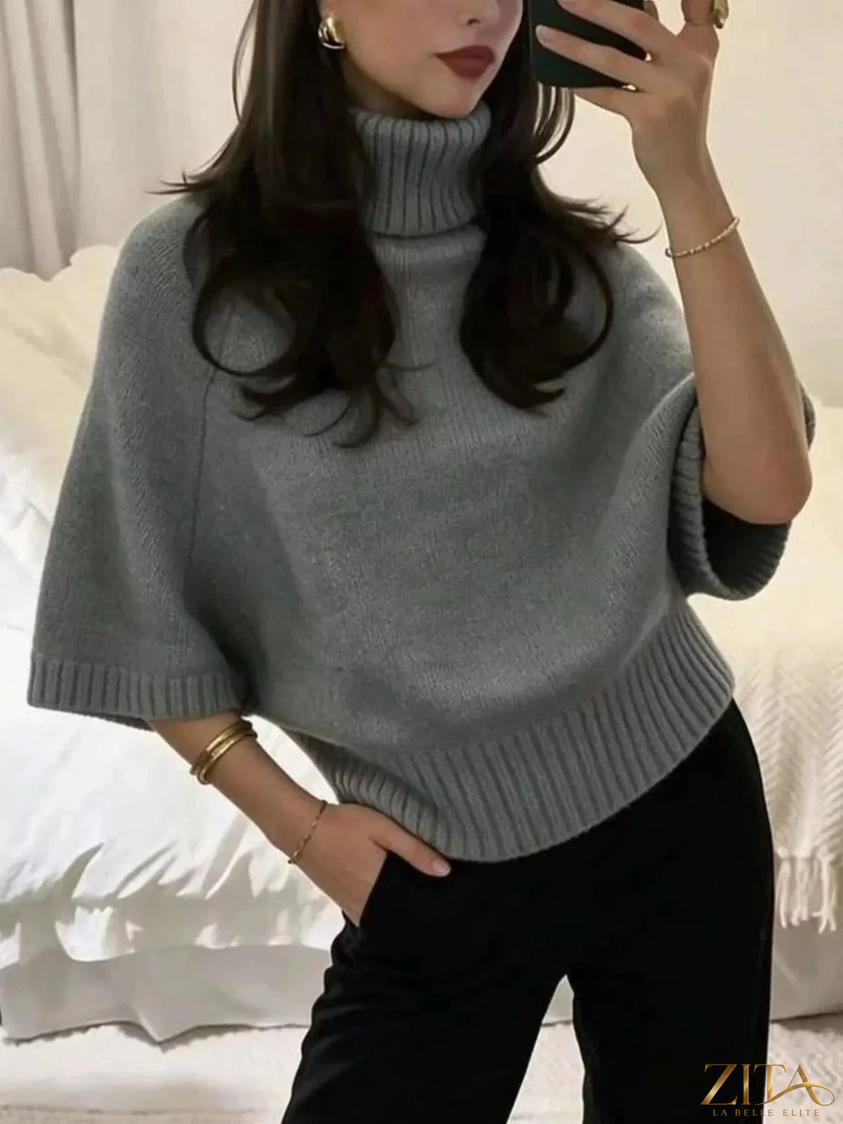 Light gray turtleneck batwing sleeve sweater by Trendsi shown on a model, featuring a cozy fit and stylish batwing sleeves.