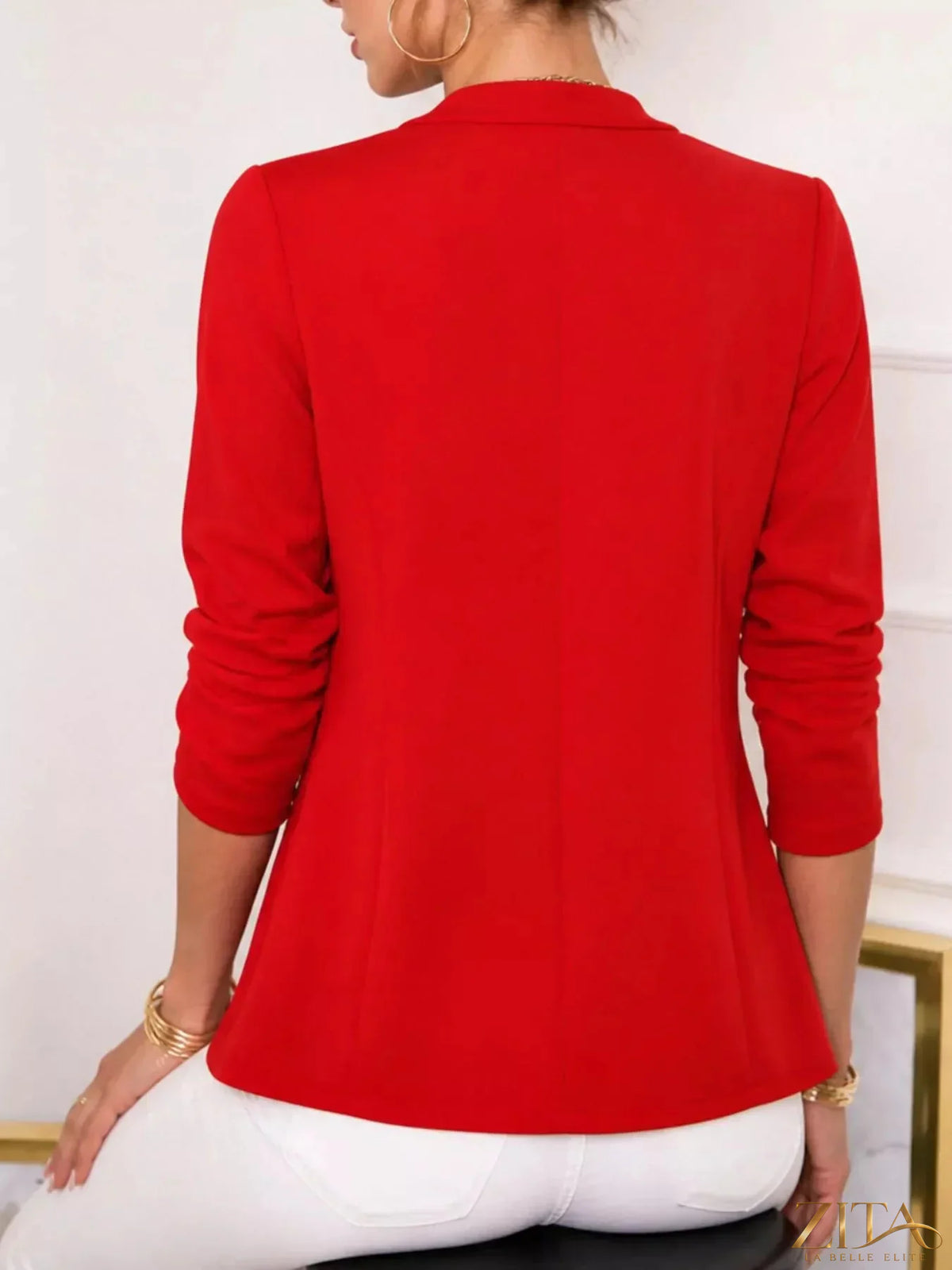 Open-front long sleeve blazer by Trendsi featuring a tailored fit, lapel collar, and classic design in neutral fabric.