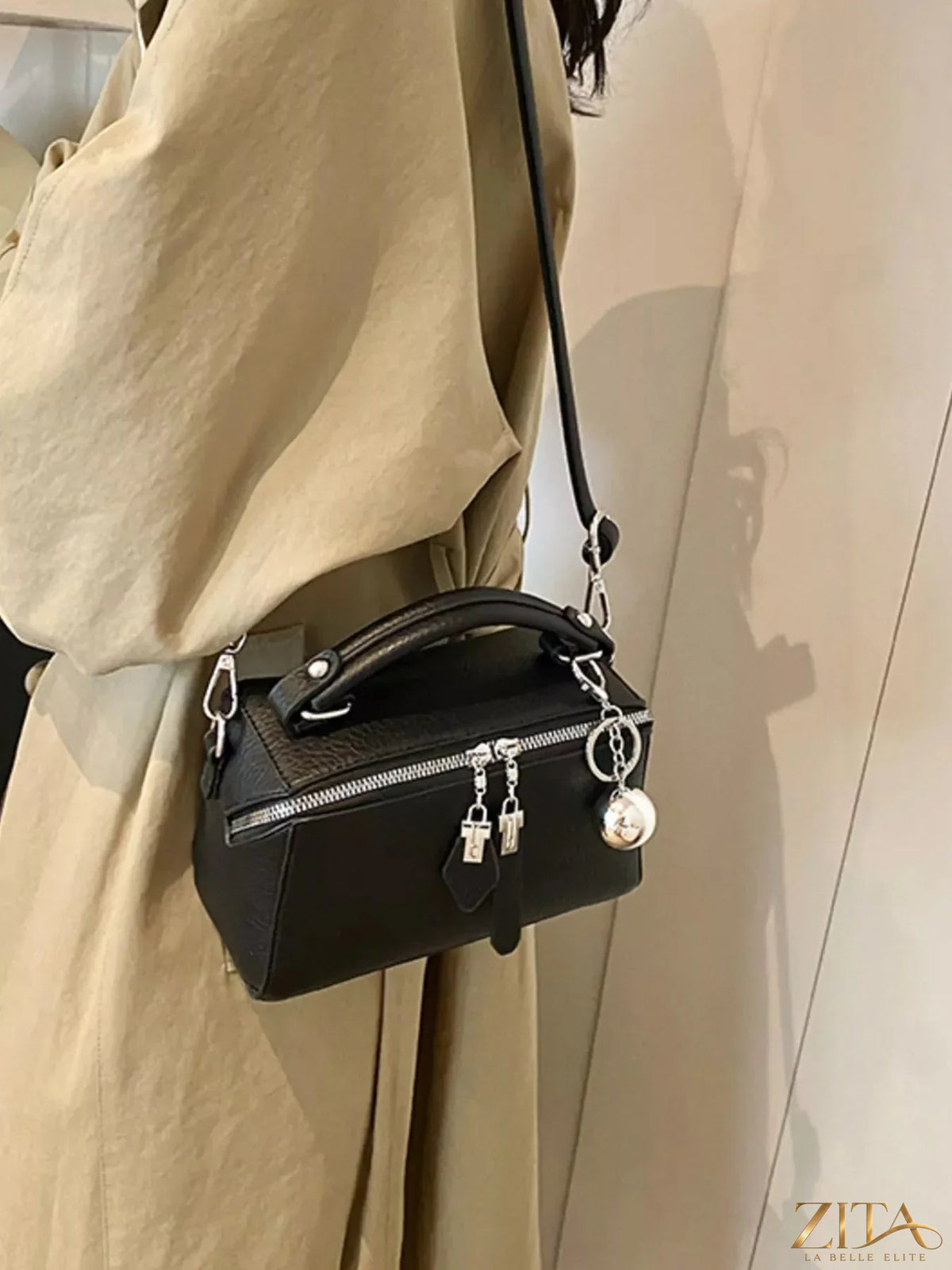 Textured leather handbag by Trendsi featuring a stylish design with sturdy handles and a spacious interior.
