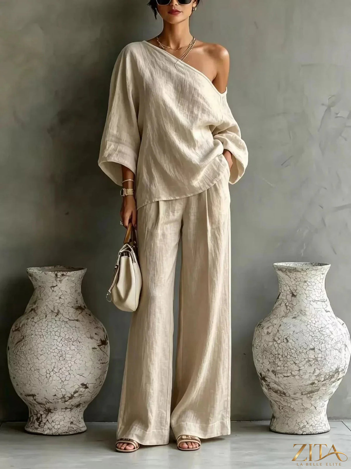 Zita La Belle Elite one shoulder top and wide-leg pants set, stylish matching outfit with a modern design, in neutral tones.