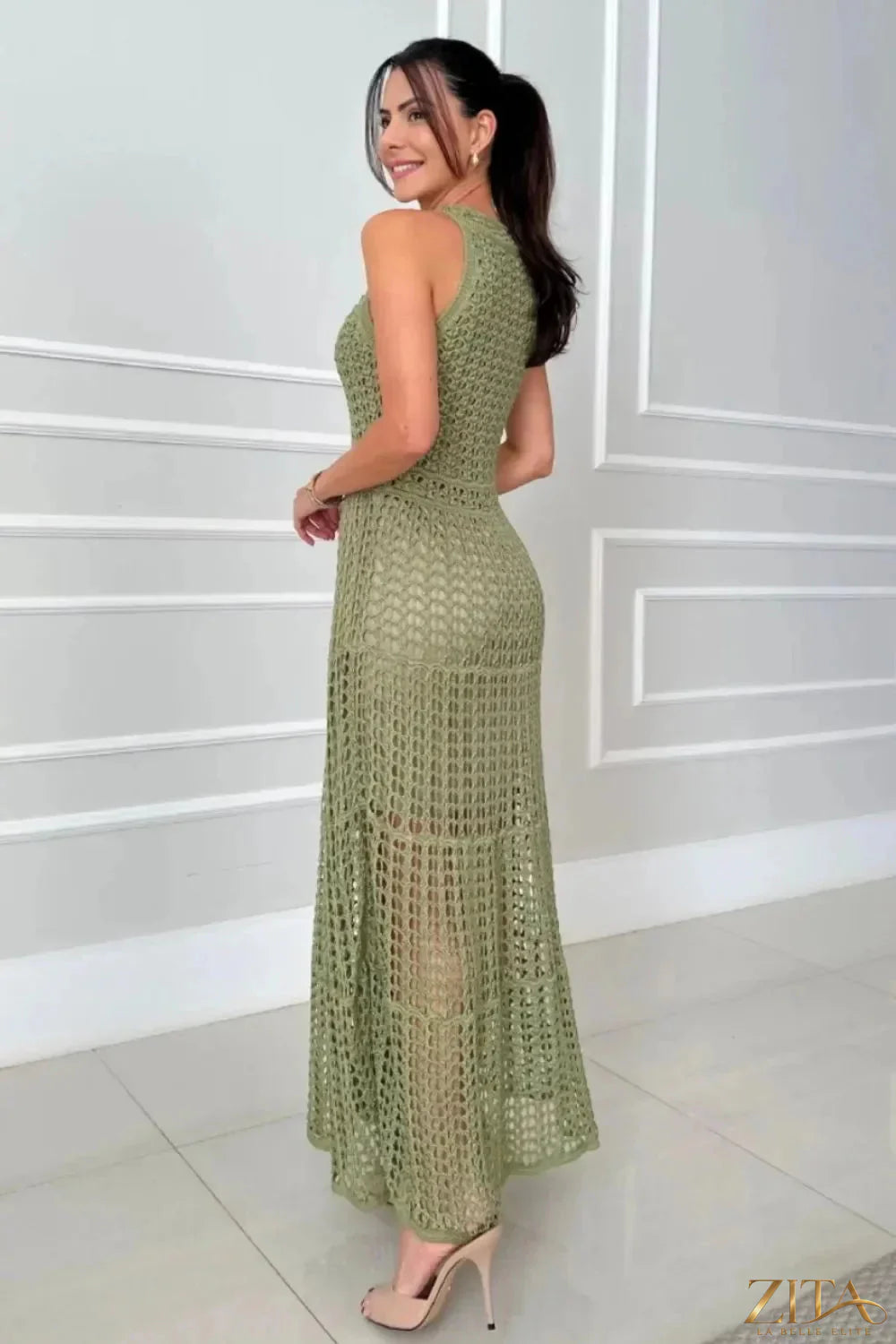 Zita La Belle Elite hollowed-out sleeveless maxi dress in black with cutout details and flowing fabric, full-length style.