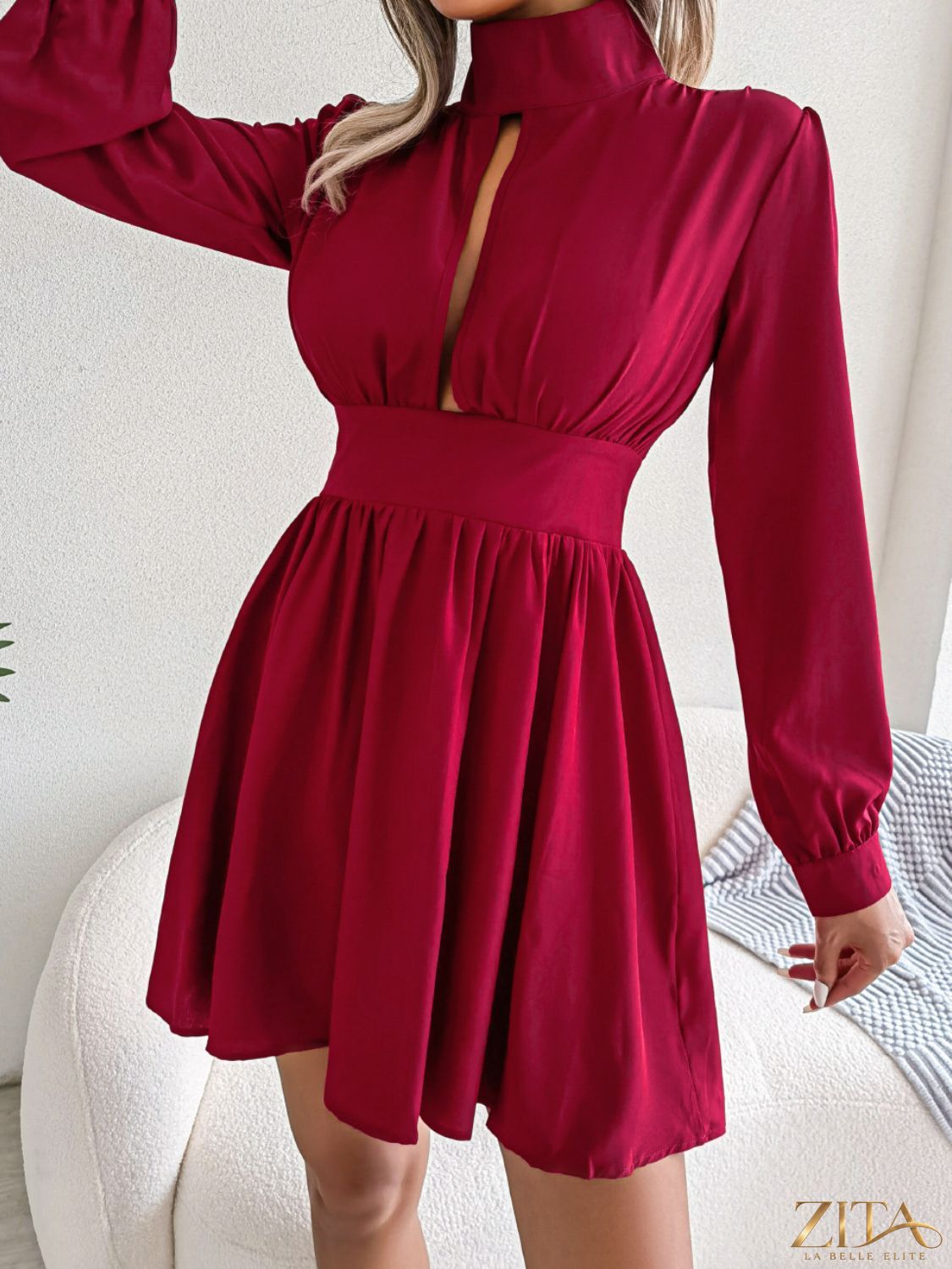 Cutout turtleneck A-line mini dress by Trendsi featuring a fitted silhouette with stylish cutout details and a classic turtleneck style.