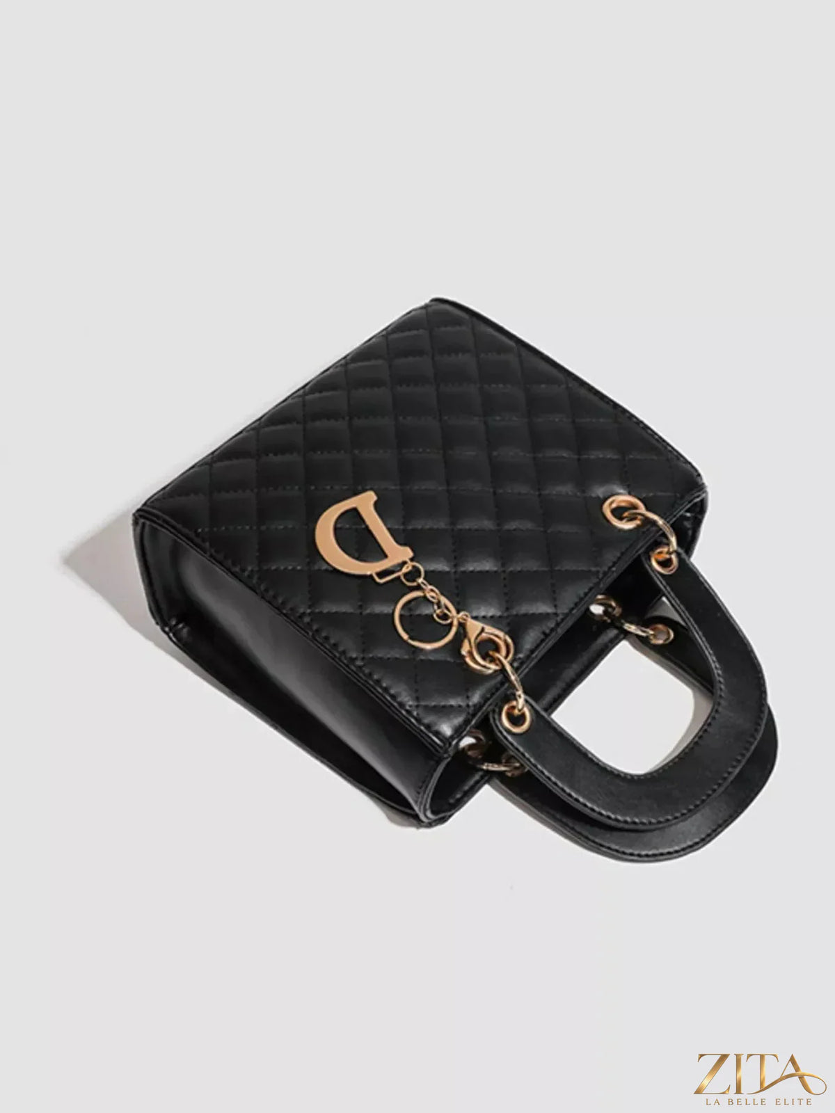 Zita La Belle Elite quilted top handle handbag with gold accents, featuring a sleek design and spacious interior.