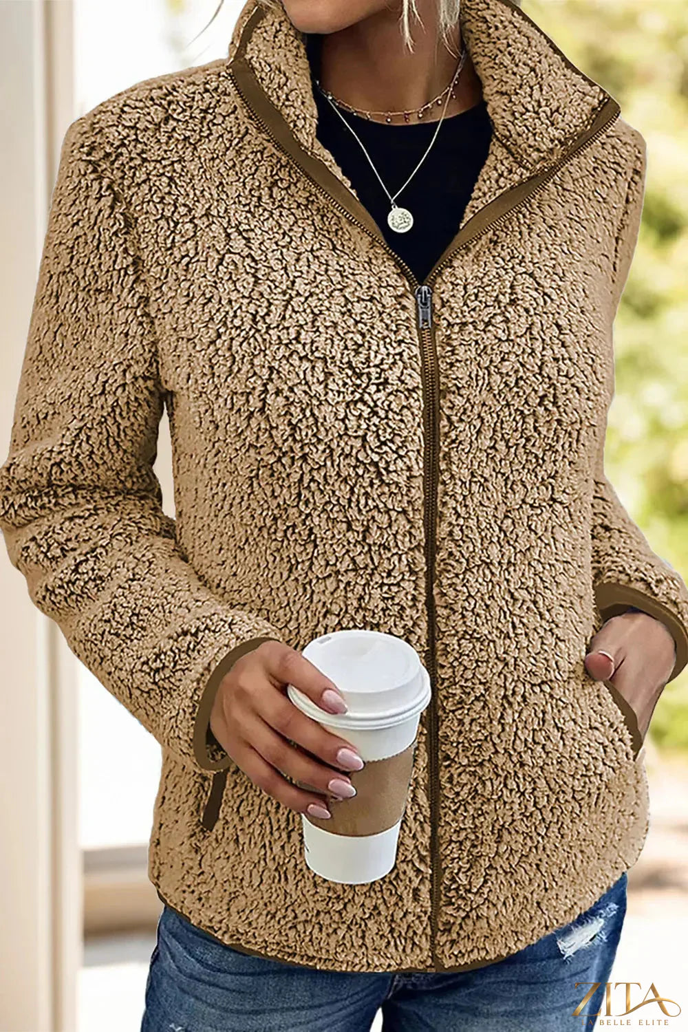 Trendsi pocketed zip-up turtleneck jacket featuring a fitted design, front pockets, and a high collar in a versatile style.