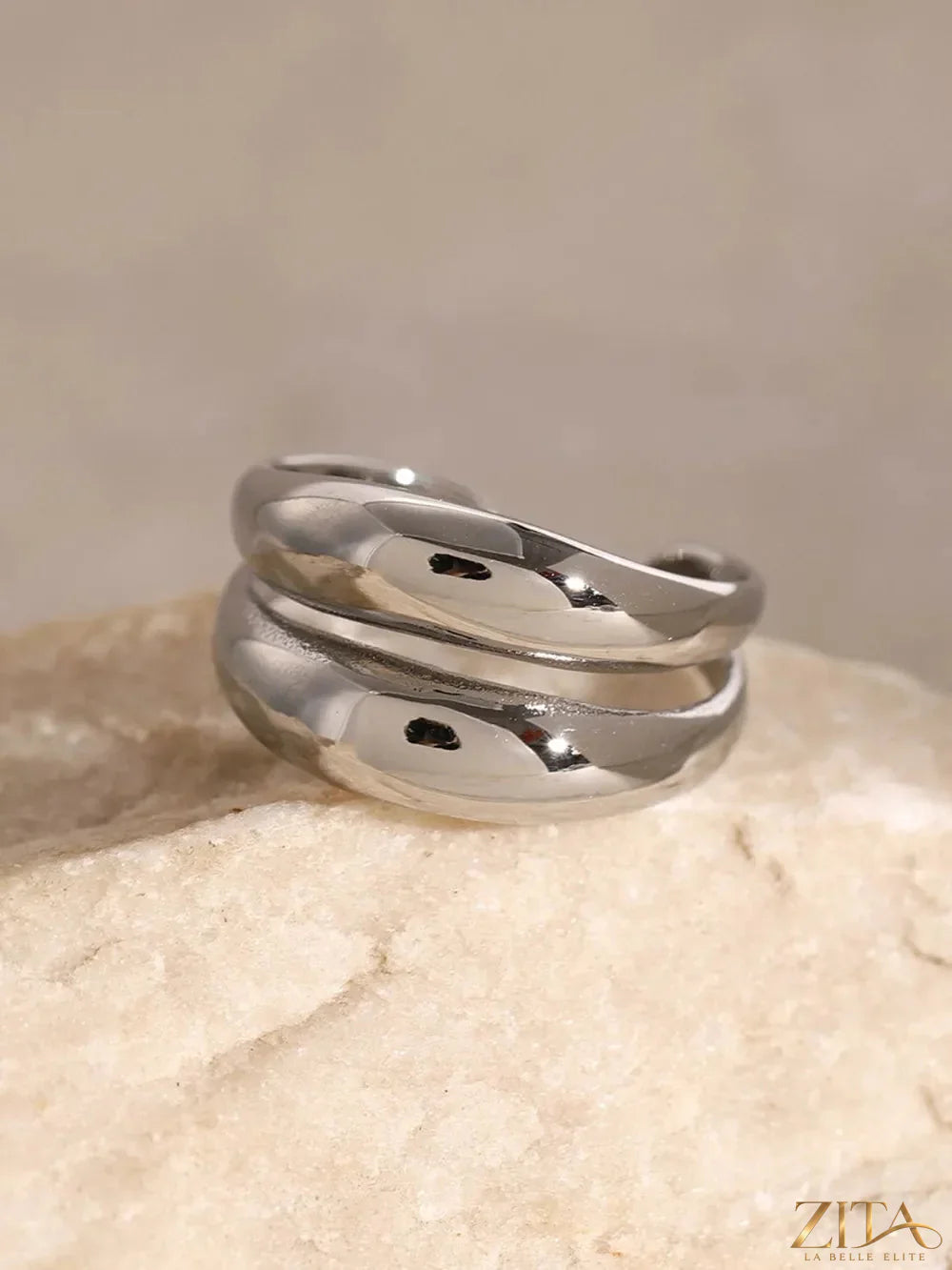 Close-up of a stainless steel double-layered ring from Zita La Belle Elite, showcasing its sleek, polished design and layered structure.
