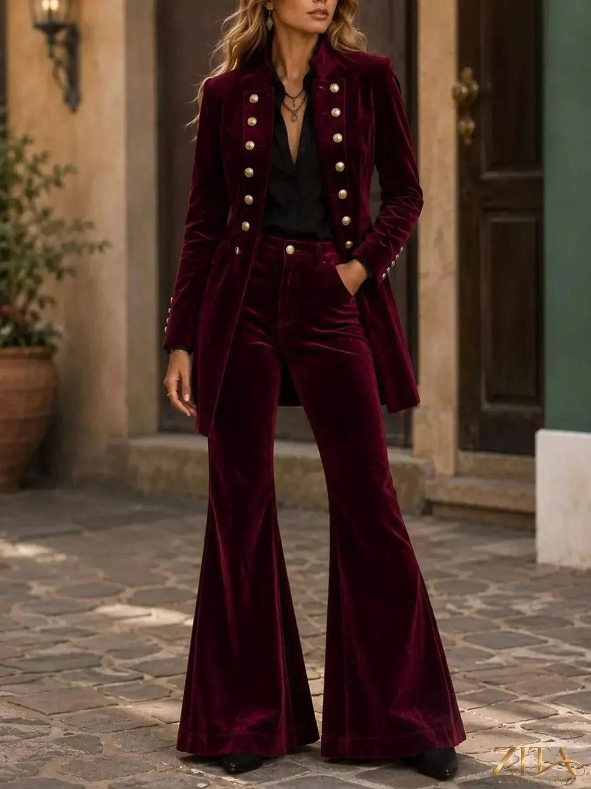 Velvet double-breasted blazer and flare pants set by Zita La Belle Elite, shown on a mannequin with a stylish indoor background.