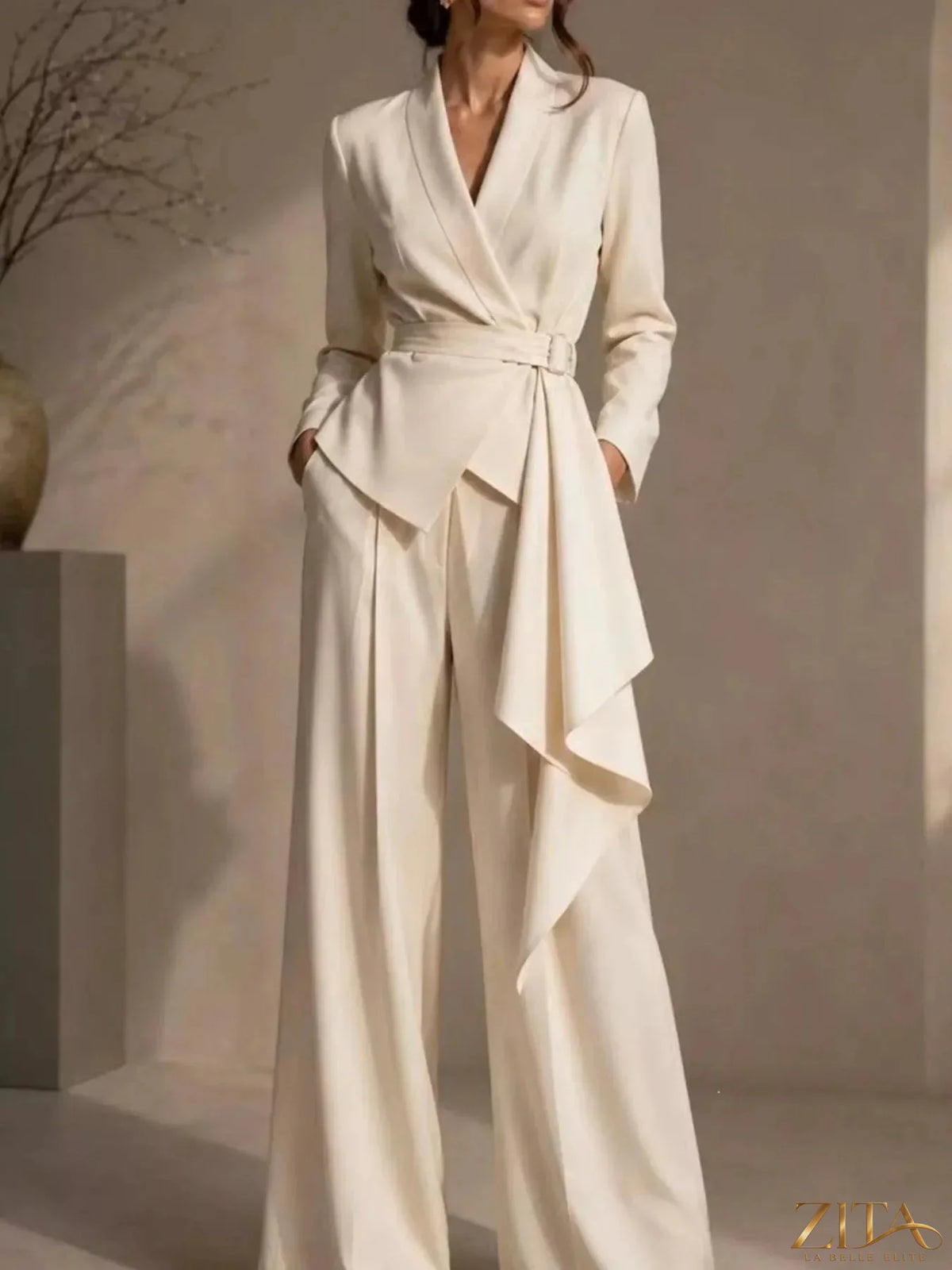 Plus size Zita La Belle Elite belted blazer and wide-leg pants set, featuring a tailored blazer with belt and flowing wide-leg trousers.