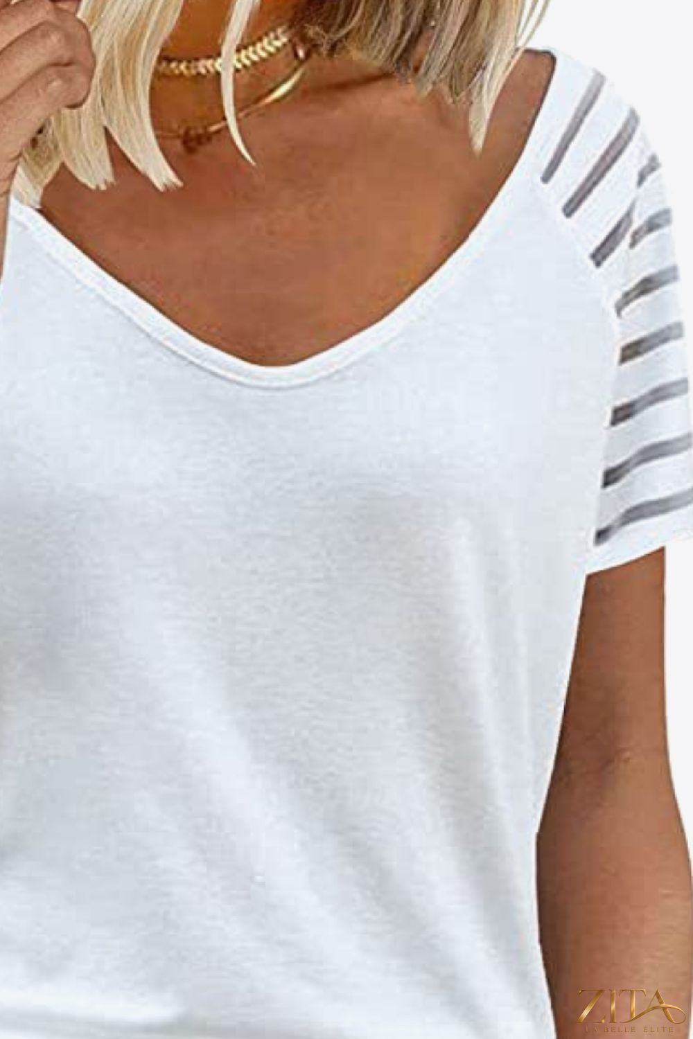 V-neck raglan sleeve tee by Trendsi, featuring contrasting colored sleeves and a relaxed fit, shown in a close-up front view.