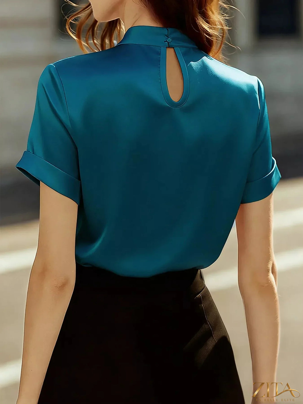Zita La Belle Elite satin keyhole short sleeve blouse with elegant design and lightweight fabric, styled on a model.