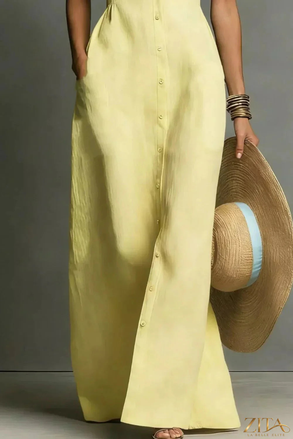 Zita La Belle Elite sleeveless button-down maxi dress in flowing fabric, full-length with a fitted waist and elegant collar.