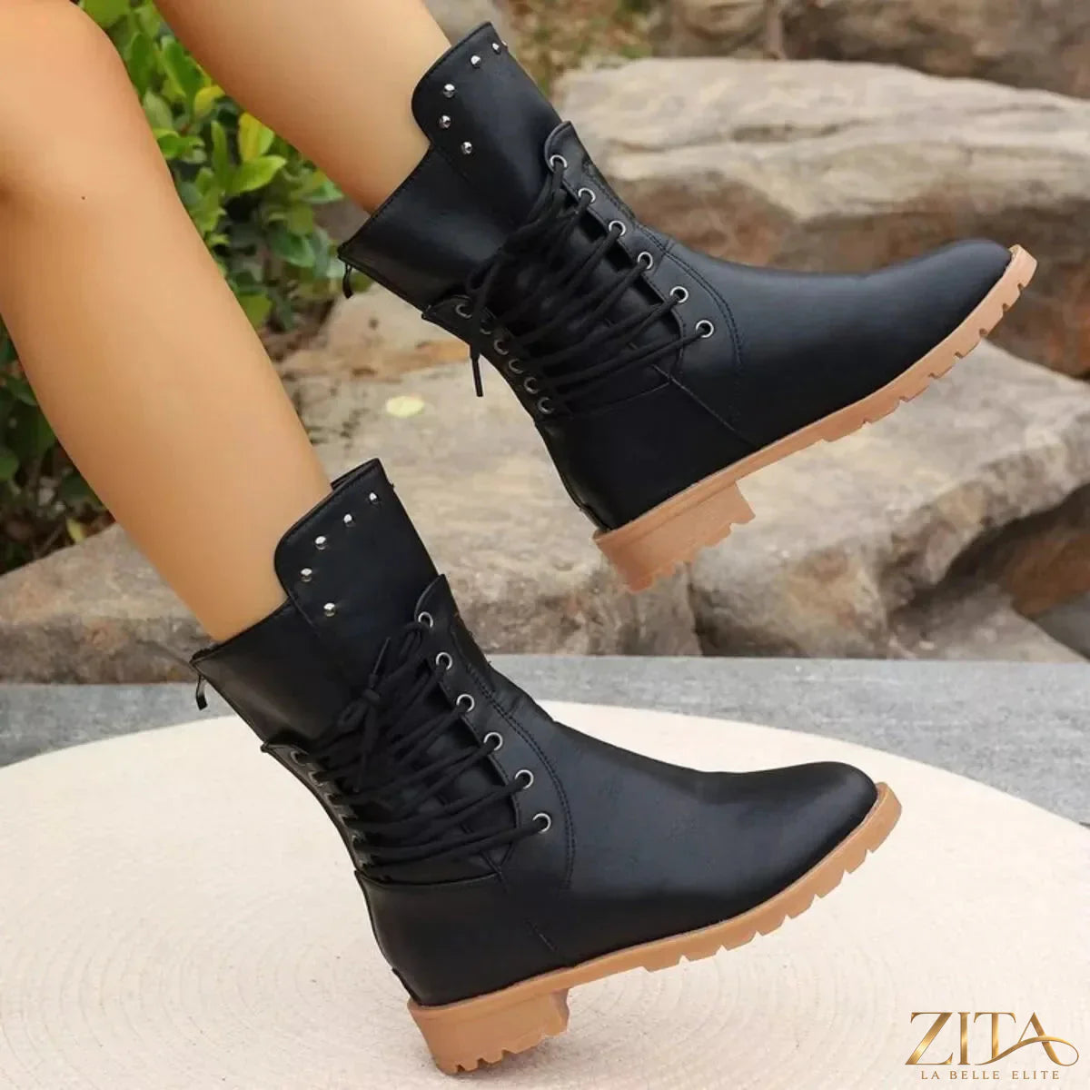 Black studded lace-up boots from Trendsi featuring a chunky heel and rugged design, perfect for edgy fashion styles.